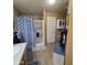 Bright bathroom featuring a glass shower, white cabinets, and a comfortable bench at 11411 N 91St Ave # 225, Peoria, AZ 85345
