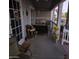 Charming front porch with a 'Welcome' bear, comfortable seating, and patriotic decorations at 11411 N 91St Ave # 225, Peoria, AZ 85345