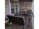 Comfortable front porch with outdoor furniture, decorative lattices, and sunny, welcoming ambiance at 11411 N 91St Ave # 225, Peoria, AZ 85345