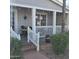 Charming front porch with inviting decor, white railings, and manicured landscaping at 11411 N 91St Ave # 225, Peoria, AZ 85345
