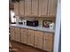 Kitchen with plenty of cabinets, countertop space, and laminate floors at 11411 N 91St Ave # 225, Peoria, AZ 85345