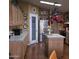 Functional kitchen with stainless steel refrigerator, pot rack, and bright countertops at 11411 N 91St Ave # 225, Peoria, AZ 85345