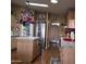 Open kitchen with island, stainless steel appliances, and wood flooring offers ample space and modern conveniences at 11411 N 91St Ave # 225, Peoria, AZ 85345