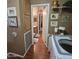 View of the laundry room leading to the bathroom showing the connection between the two spaces at 11411 N 91St Ave # 225, Peoria, AZ 85345