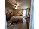 Spacious main bedroom features a ceiling fan, plush carpet, and lots of decorations at 11411 N 91St Ave # 225, Peoria, AZ 85345