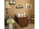 Office area with lamp, desk with drawers, and decorated with flowers and art at 11411 N 91St Ave # 225, Peoria, AZ 85345