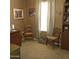 Home office features natural lighting, wooden furniture, and a cozy, functional workspace at 11411 N 91St Ave # 225, Peoria, AZ 85345