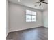 Bedroom with dark wood floors, window with blinds, and ceiling fan at 1238 S 14Th St, Phoenix, AZ 85034