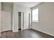 Bedroom with double door closet and dark hardwood floors at 1238 S 14Th St, Phoenix, AZ 85034