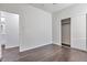 Bright bedroom with wood-look floors, spacious closet, and access to bathroom at 1238 S 14Th St, Phoenix, AZ 85034