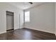 Bedroom with double door closet and dark hardwood floors at 1238 S 14Th St, Phoenix, AZ 85034