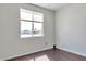Bright bedroom with large window and dark hardwood floors at 1238 S 14Th St, Phoenix, AZ 85034
