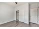 Bedroom with double door closet and dark hardwood floors at 1238 S 14Th St, Phoenix, AZ 85034