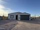 New construction home with gray garage door and landscaped front yard at 1238 S 14Th St, Phoenix, AZ 85034
