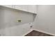 Laundry room with white cabinets and vinyl flooring at 1238 S 14Th St, Phoenix, AZ 85034