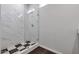 Modern shower with marble-look tile and glass enclosure at 1238 S 14Th St, Phoenix, AZ 85034