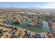 Aerial view of a luxurious waterfront community with many large houses at 1326 E Clearwater Ln, Gilbert, AZ 85234