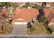 Aerial view of a single-Gathering home with a two-car garage and well-maintained lawn at 1326 E Clearwater Ln, Gilbert, AZ 85234
