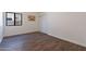Charming bedroom featuring wood-look floors and a double door closet at 1326 E Clearwater Ln, Gilbert, AZ 85234