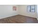 Bright bedroom with wood-look floors and neutral walls at 1326 E Clearwater Ln, Gilbert, AZ 85234