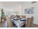 Bright dining room with a rustic table and wicker chairs at 1326 E Clearwater Ln, Gilbert, AZ 85234
