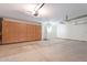 Garage with built-in wooden cabinets and extra space at 1326 E Clearwater Ln, Gilbert, AZ 85234