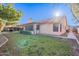 House exterior with backyard and patio area at 1326 E Clearwater Ln, Gilbert, AZ 85234
