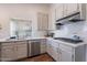 Updated kitchen with light cabinets, marble countertops, and stainless steel appliances at 1326 E Clearwater Ln, Gilbert, AZ 85234