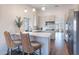 Eat-in kitchen with breakfast bar and modern finishes at 1326 E Clearwater Ln, Gilbert, AZ 85234