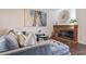 Living room features a fireplace and comfy couch at 1326 E Clearwater Ln, Gilbert, AZ 85234