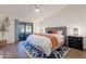 Main bedroom with a gray headboard and sliding door access at 1326 E Clearwater Ln, Gilbert, AZ 85234