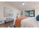 Spacious main bedroom with large artwork and access to bathroom at 1326 E Clearwater Ln, Gilbert, AZ 85234