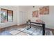 Spacious home office with glass-top desk and modern artwork at 1326 E Clearwater Ln, Gilbert, AZ 85234