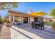 Patio with seating area and yellow umbrella at 1326 E Clearwater Ln, Gilbert, AZ 85234