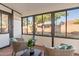 Relaxing sunroom with wicker chairs and backyard views at 1326 E Clearwater Ln, Gilbert, AZ 85234