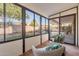 Bright sunroom with wicker chairs and view of backyard at 1326 E Clearwater Ln, Gilbert, AZ 85234