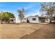 Spacious backyard with gravel and a storage shed at 136 S 90Th Pl, Mesa, AZ 85208