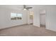 Bright bedroom with ceiling fan and carpet flooring at 136 S 90Th Pl, Mesa, AZ 85208