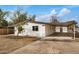 View of a remodeled home with carport and gravel yard at 136 S 90Th Pl, Mesa, AZ 85208