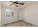 Well-lit bedroom with ceiling fan and window at 14050 N 47Th Ave, Glendale, AZ 85306