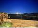Night view of backyard with moonlit mountain views at 15047 S 178Th Dr, Goodyear, AZ 85338