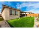 Home's backyard with artificial turf and a patio area at 15047 S 178Th Dr, Goodyear, AZ 85338