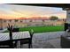 Covered patio overlooks a grassy backyard with mountain views at 15047 S 178Th Dr, Goodyear, AZ 85338