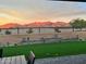 Artificial turf backyard with mountain views and seating at 15047 S 178Th Dr, Goodyear, AZ 85338