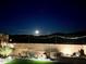 Night view of backyard with moonlit mountain views at 15047 S 178Th Dr, Goodyear, AZ 85338