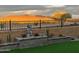 Landscaped backyard with a water fountain and mountain views at 15047 S 178Th Dr, Goodyear, AZ 85338