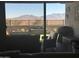 Backyard patio and mountain views seen through sliding glass doors at 15047 S 178Th Dr, Goodyear, AZ 85338