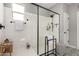 Modern bathroom with a large walk-in shower and patterned floor at 15047 S 178Th Dr, Goodyear, AZ 85338