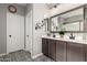 Elegant bathroom with double vanity, designer tile, and modern fixtures at 15047 S 178Th Dr, Goodyear, AZ 85338
