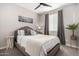 Charming bedroom with a comfortable bed, stylish decor, and plenty of natural light at 15047 S 178Th Dr, Goodyear, AZ 85338
